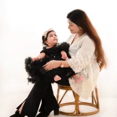 A tender moment between mother and daughter. These quiet, intimate shots are just as important as the full family portraits, highlighting that special, unbreakable bond.
