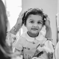 A sweet moment between mother and daughter, getting ready for her birthday celebration. These black and white photos add a timeless, documentary feel.