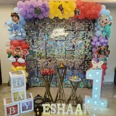 Another angle of the Cocomelon party decor, highlighting the light-up number '1', 'B-A-B-Y' blocks, and personalized name display.