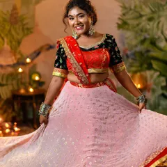 A closer look at the 'Ram Leela' ensemble, highlighting the detailed embroidery on the black velvet blouse and the light, airy fabric of the pink skirt.