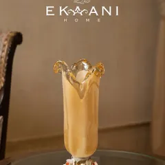 Hand-blown in the heart of Murano, this glass vase is a masterclass in form and fire. Resting on a porcelain rose base, it is not just decor, it is a conversation that lingers, turning any corner into a focal point.