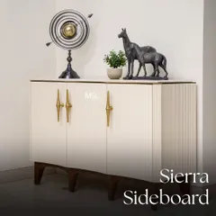 This cozy and chic living space showcases a perfect balance of comfort and style. At its heart is our Aster lounge chair in smooth ivory upholstery, complemented by the Sierra sideboard which infuses a touch of mid-century glamour with its fluted design.