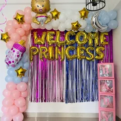 Make her feel like royalty with this "Welcome Princess" decoration. It features a shiny foil curtain backdrop in pink and blue, a balloon arch, and "BABY" boxes. I can customize the colors and message for you.