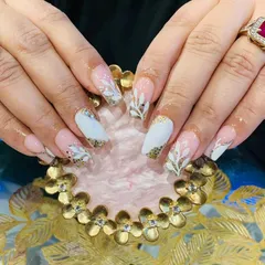 An elegant design perfect for a celebration, with white and gold glitter accents and hand-painted white leaves on a sheer pink base.
