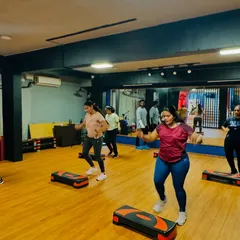 Our members in the middle of a challenging but rewarding step routine. You can see the energy and determination in the room.