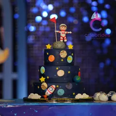 No themed party is complete without a matching cake. This amazing three-tiered space-themed cake was the centerpiece of the dessert table.