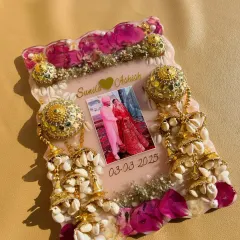 A different angle of the kalire preservation frame, showing the intricate details of the preserved flowers, shells, and traditional elements.