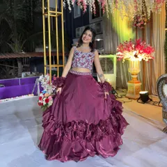This outfit is perfect for twirling on the dance floor. The ruffled organza skirt moves beautifully, making it a fun and photogenic choice.