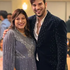 Another photo of Paras Chhabra at an event, showcasing how the embellished blazer looks in a real-world setting. It's designed to be comfortable yet make a statement.
