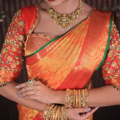 More shots of this gorgeous red and orange Kanchipuram saree. For photoshoots, I ensure every detail, from the pallu to the waist pleats, is absolutely perfect.