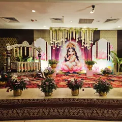 Another angle of the Lakshmi themed decor, showing the balance of traditional elements and modern event design for a naming ceremony or cradle party.