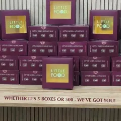 Whether it's 5 boxes or 500, I've got you covered. This image shows stacks of my signature purple boxes, ready for a large delivery, demonstrating my capability to handle orders of any size with professionalism.