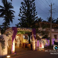 A wider view of the Roce ceremony entrance at dusk, showcasing the house lighting and the beautifully lit pathway that welcomes guests.