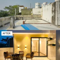 This forgotten corner with stained walls is now a chic and cozy patio. We cleaned up the facade, installed elegant wall sconces, and added stylish wicker furniture, making it the perfect spot for morning coffee.