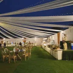 Picture this: an elegant outdoor reception under a canopy of flowing white drapes and twinkling fairy lights. I design the entire atmosphere to make your event feel magical, from the grand layout to the smallest detail.