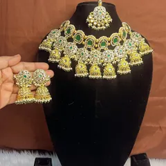 Our green and gold choker set, shown here with the matching earrings. This is a perfect choice for bridesmaids or family who want an elegant but not overpowering look. The quality and design are sure to get compliments.