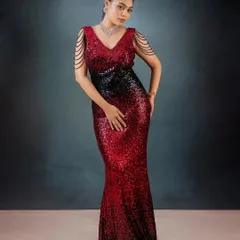 A full-length studio shot of the red and black sequin gown, showcasing its flawless fit and the dramatic mermaid flare that creates a stunning silhouette.