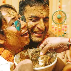 Pure, unadulterated laughter during a fun-filled Haldi ceremony. Our candid photography style ensures we capture the real emotions and hilarious moments that make your wedding celebrations unique.