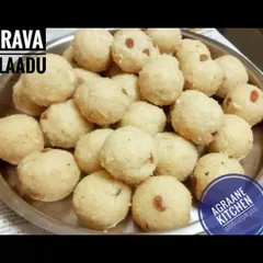 A plate of classic Rava Laadu, made with roasted semolina, coconut, sugar, and ghee. These are a timeless sweet, perfect for festivals or as a simple, comforting dessert.