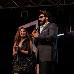 Candid moments like these with celebrity guests help create a relaxed and enjoyable atmosphere for the event.