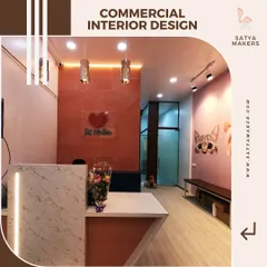 This image highlights the key elements of a successful commercial interior design. The combination of ambient and track lighting, a distinct feature wall, and a prominent reception desk sets the tone for the entire retail experience.