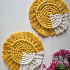 These cheerful spiral coasters feature a sunny yellow and white design, bringing a happy vibe to your coffee table.