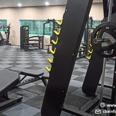 This view highlights some of our specialized strength training equipment, including a leg press and Smith machine. These machines allow for safe and effective development of key muscle groups used in badminton.