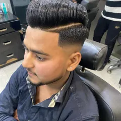 A perfect high-volume pompadour isn't just about height, it's about the flawless blend. Here, I executed a clean skin fade that transitions smoothly into a full, styled top.