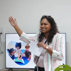 During a Parent Orientation, I am explaining how play-based education nurtures critical thinkers. Building a strong partnership with parents is a crucial part of creating a supportive learning community for every child.