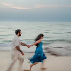 I love using motion blur to capture the energy of a moment. Here, this couple runs along the shoreline during their Goa beach session, creating a dynamic and artistic photograph that feels full of life and movement.