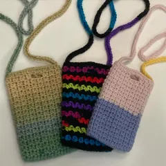 A collection of my adorable and colorful phone slings. They are perfect for when you want to be hands-free but still keep your phone close and accessible.