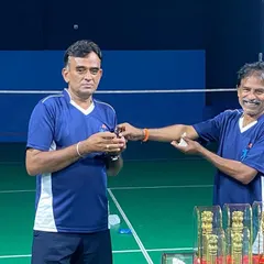 A player receives his prize during the awards ceremony for the adult tournament, celebrating the competitive spirit within our academy.