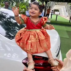 There is nothing more special than creating a tiny outfit from a mother's saree. I designed this adorable silk frock for a little princess, complete with puffed sleeves and using the rich brocade for the skirt.