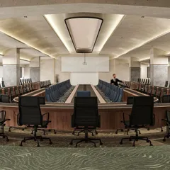 A duplicate image of the impressive conference hall, highlighting the meticulous planning of seating arrangements and technology integration.