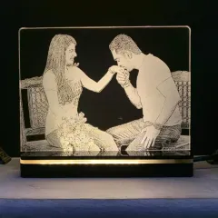 Light up your favorite memories with my custom engraved acrylic lamps. I can etch any photo onto the plaque, which sits on an illuminated wooden base, creating a unique and romantic piece of decor for your room.