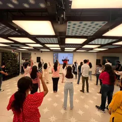 An instructor leads the employees at Pearson India through a fun dance routine. Our workshops are designed to be inclusive for all, regardless of prior dance experience.