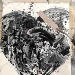 Here I am, working on a black and white heart with a palette knife. This is where the texture is born. It's a process of building up and scraping away, a reflection of my own inner work.