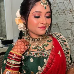 A close-up of my Gujarati bride Gauri's wedding makeup. The look features shimmery green and gold eyeshadow to match her stunning jewellery.