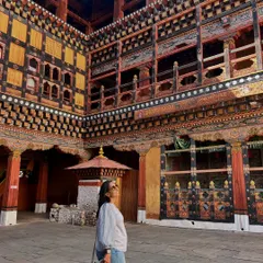 Inside the majestic Punakha Fortress, surrounded by incredible wood crafting and painted details. The scale and artistry of Bhutanese architecture is a powerful source of creative inspiration.