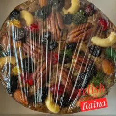 Another look at the rich topping of my plum cake, featuring whole pecans, cashews, and colourful candied fruits. I make sure every bite is full of flavour and texture.