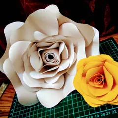 Another look at the handmade paper roses. The large white one and smaller yellow one are practice pieces, showing the different sizes I can create.