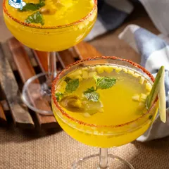 Our Mango Chilli cooler is the perfect balance of sweet and spicy, served in a chili-rimmed glass for that extra kick.