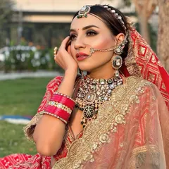 A bride's glow is truly special. For this outdoor shoot, I created a radiant look with soft, smokey eyes and a bold lip that stands out beautifully in natural light.