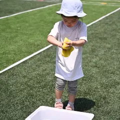 A young participant in our Playgroup category is focused on a water and sponge activity. Even our youngest campers have their own set of challenges that develop their fine and gross motor skills.