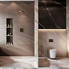 We used three distinct marble patterns in this bathroom to create a visually rich and luxurious space. The design includes a walk-in shower with a gold rain showerhead and a built-in niche for toiletries, combining beauty with practicality.