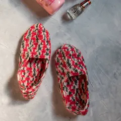 A top-down view of our handmade loafer-style socks. They are made with soft, warm yarn to keep your feet comfortable on cold floors.