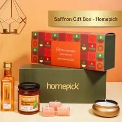 This Saffron Gift Box makes for a luxurious and traditional wedding gift. It includes saffron-infused syrup, mango kernel pickle, and scented candles for a touch of festive elegance.
