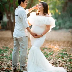 A sweet, candid moment during an outdoor shoot, as he gently brushes her hair from her face. It's these small gestures that tell the biggest love stories.