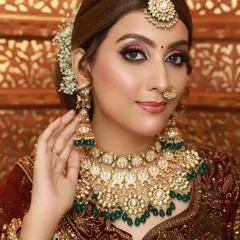 A classic glam look with a brown smokey eye and nude lip. This versatile style is perfect for any wedding guest or for a festive occasion.