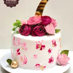 A floral cake for a 7th birthday, featuring hand-painted flowers and a topper. This exotic fruit cake is a great example of a non-fondant, elegant design.